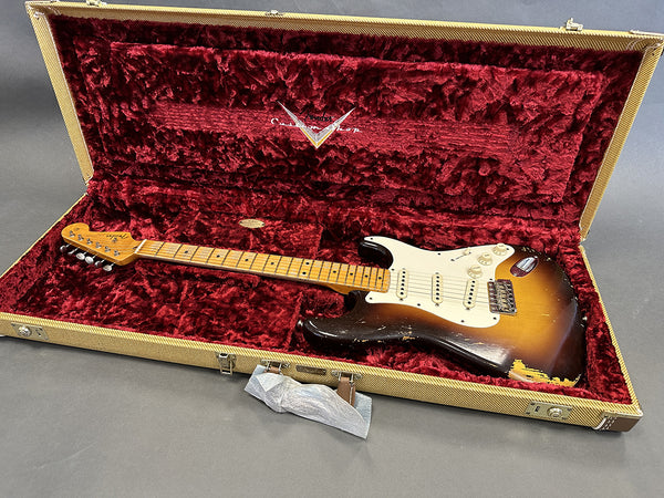Vintage Fender Stratocaster electric guitar with sunburst finish in open tweed hard case with red plush interior at Coffee House Guitars