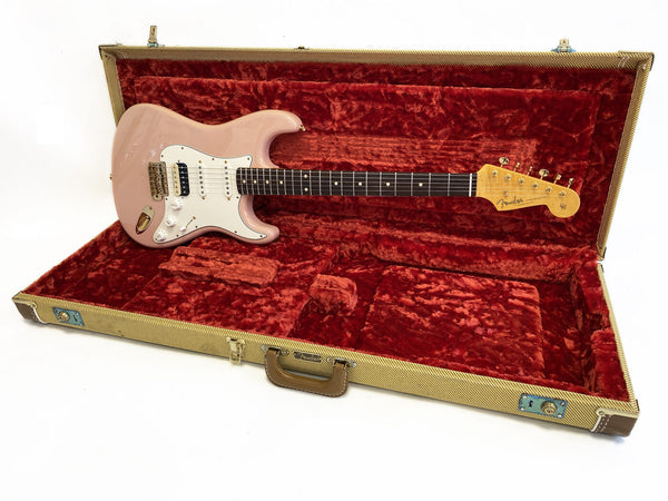 Pink Fender Stratocaster electric guitar with rosewood fretboard in vintage tweed hard case with red plush interior