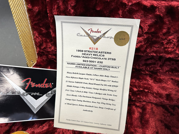 Fender Custom Shop certificate for 1959 Stratocaster Heavy Relic Faded Aged Chocolate 3TSB with specifications and sold sticker on red plush case lining.