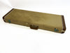 Vintage tweed guitar case with brown leather handle and corner reinforcements on white background