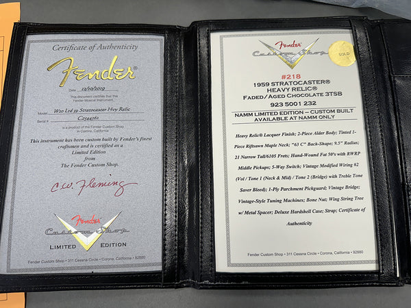 Fender Custom Shop Certificate of Authenticity for 1959 Stratocaster Heavy Relic Faded Aged Chocolate 3TSB NAMM Limited Edition guitar with detailed specifications and signing by C.W. Fleming in black leather folder