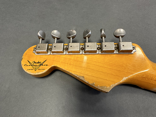 Fender Custom Shop Limited Edition guitar headstock with six vintage tuners and worn wood finish on dark gray background