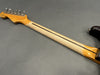 Maple guitar neck with vintage-style tuners and two-tone finish showing wear and relic effect on gray background
