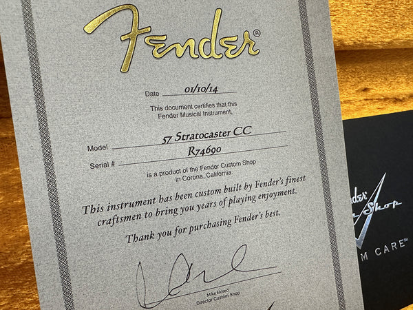 Fender Custom Shop certificate of authenticity for 57 Stratocaster CC guitar dated 01/10/14 with serial number R74690 signed by Mike Eldred Director Custom Shop