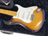 Vintage Fender Stratocaster electric guitar with sunburst finish and maple neck in black plush guitar case with Fender Custom Shop cable