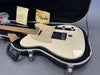 Vintage white Fender Telecaster electric guitar with maple neck and pearl pickguard in black hardshell case, includes Fender polishing cloth and original paperwork