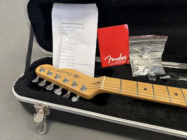 Fender Telecaster guitar headstock with tuning pegs in black plush-lined hard case, Fender warranty booklet, extra parts in plastic bag, and Coffee House Guitars pre sales check list.