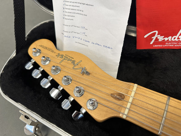 Fender Telecaster electric guitar maple neck headstock with tuning pegs, inside hard case with setup checklist and Fender warranty card visible