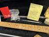Fender guitar neck with maple fretboard inside guitar case, includes Fender warranty booklet, B-Bender instruction manual, guitar setup wrench, and small hardware parts in plastic bag.