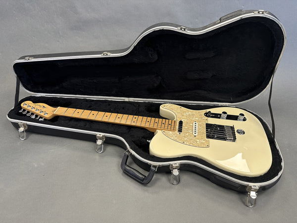 Fender Telecaster electric guitar with cream finish and maple neck in black hard shell case with plush interior