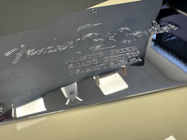 Close-up of Fender B-Bender chrome backplate with engraved Fender logo and patent information on electric guitar