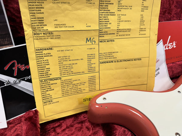 Fender Custom Shop certificate of authenticity with detailed specs for a 2020 Time Machine Stratocaster, featuring faded aged Tahitian Coral Poblano Relic finish and vintage style hardware, next to a coral-colored Fender guitar body in a red plush case.