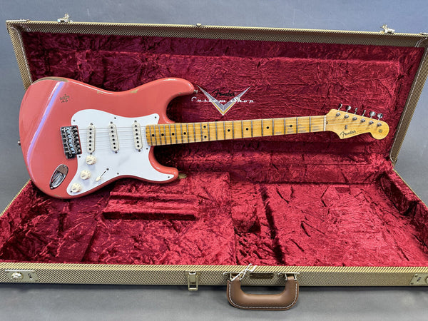 Fender Custom Shop Vintage Coral Pink Stratocaster electric guitar with maple neck and white pickguard in tweed hard case with red plush interior