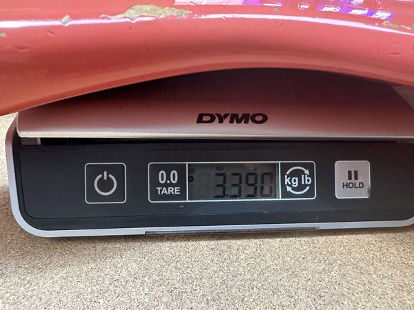 Digital DYMO scale showing weight of 3.390 kilograms for guitar measurement at Coffee House Guitars