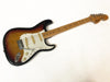 Fender Stratocaster electric guitar with sunburst finish and maple neck on white background