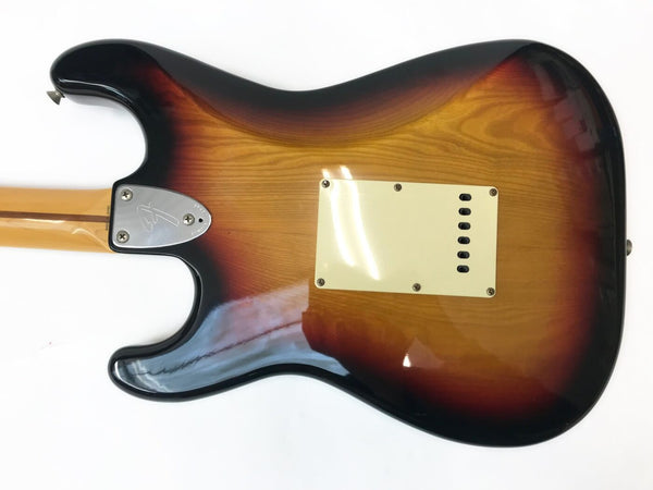Back view of Fender Stratocaster electric guitar with sunburst finish and chrome neck plate on white background