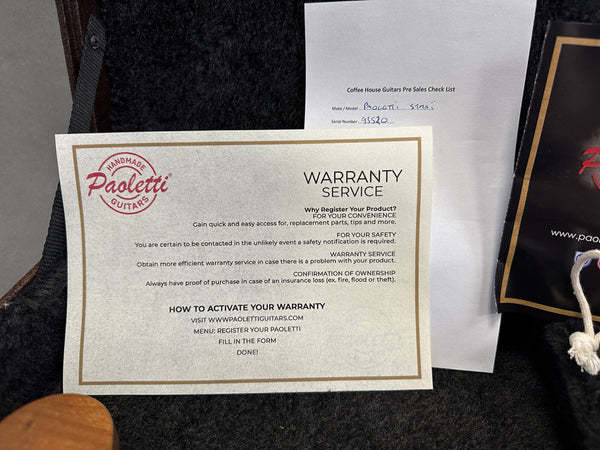 Paoletti Guitars warranty service registration card and Coffee House Guitars pre sales checklist with the make and model "Paoletti Sina" and serial number 93520 on black guitar case lining.