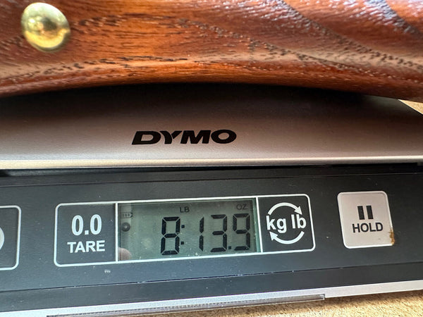 Digital scale showing guitar weight of 8 pounds 13.9 ounces for Coffee House Guitars product listing