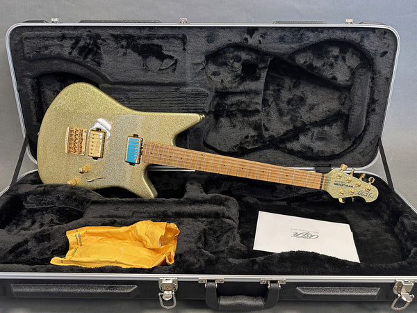 Music Man Albert Lee electric guitar with gold sparkle finish in black plush hard case with accessories and paperwork