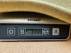 Digital scale weighing a metallic gold guitar body showing 3.444 pounds on DYMO scale display