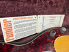 Fender Precision Bass instruction manual with detailed guitar features diagram and close-up of vintage bass guitar body with tortoise shell pickguard and control knobs on plush background.