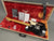 Fender Limited Edition Telecaster electric guitar with maple neck and black body in open hard case with red plush interior, original Fender certificate and owner’s manual, and black leather strap.