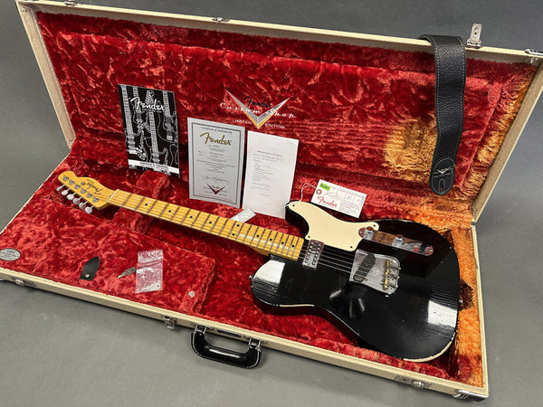 Fender Limited Edition Telecaster electric guitar with maple neck and black body in open hard case with red plush interior, original Fender certificate and owner’s manual, and black leather strap.