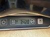 Close-up of digital scale showing 3.420 kilograms weight of a guitar body piece with worn edge, displayed for Coffee House Guitars product listing.