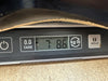 Digital scale showing a guitar weight of 7 pounds 8.6 ounces with tare and unit conversion buttons visible.