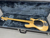 Vintage natural finish Music Man StingRay bass guitar with maple neck and black pickguard in open plush blue-lined hard case