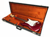 Fender Stratocaster electric guitar in candy apple red finish with white pickguard inside vintage orange plush-lined hard case