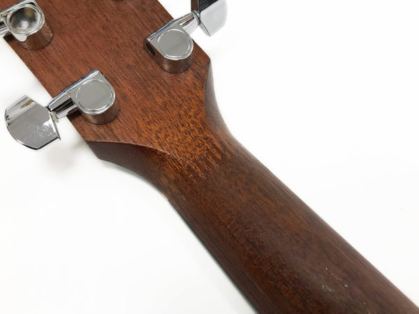 Close-up of guitar neck back showing dark wood grain and chrome tuning pegs on white background