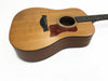 Acoustic guitar with natural wood top and dark wood sides and back on white background
