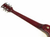Back view of guitar neck with six chrome tuning pegs on glossy dark red wood finish