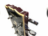 Close-up of damaged Yamaha guitar headstock with tuning pegs and dark wood finish against white background