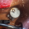 Close-up view of a 38K potentiometer and capacitor wiring inside the guitar electronics cavity showing soldered connections and components for guitar tone control.